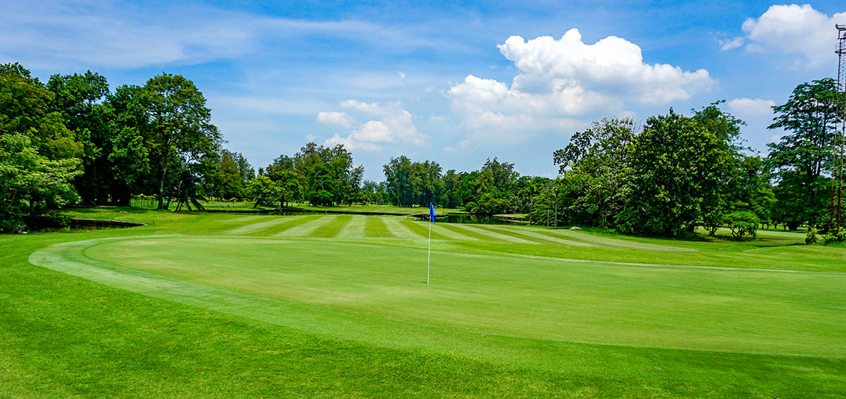 Ekachai Golf and Country Club green grass and blue skies